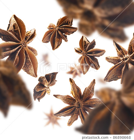Anise stars levitate on a white background Anise stars levitate on a white background 86898668