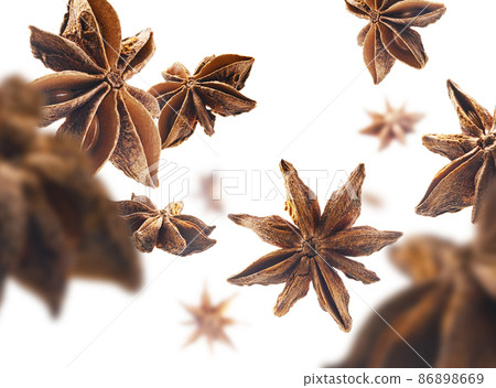 Anise stars levitate on a white background 86898669