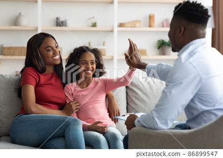 Black mother and daughter at the appointment with a psychologist Black mother and daughter at the appointment with a psychologist 86899547