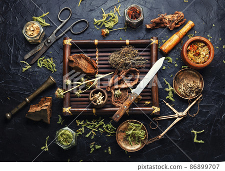 Tray with healing herbs. 86899707