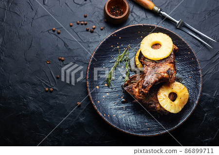 Meat grilled with pineapple rings. Meat grilled with pineapple rings. 86899711