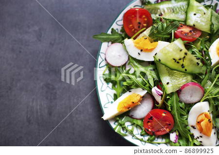 Greek salad in red boul Greek salad in red boul 86899925