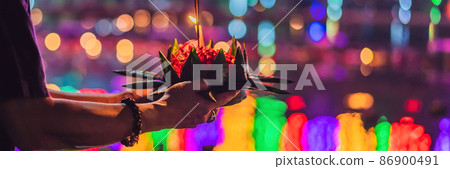Loy Krathong festival, People buy flowers and candle to light and float on water to celebrate the Loy Krathong festival in Thailand BANNER, LONG FORMAT 86900491