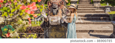 Young woman tourist in Taman Tirtagangga, Water palace, Water park, Bali Indonesia BANNER, LONG FORMAT 86900785