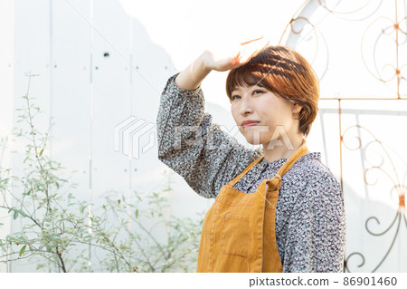 A woman enjoying gardening 86901460