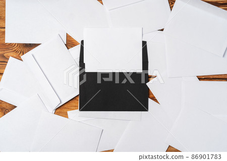 Stack of envelopes on working desk top view. Business mail Stack of envelopes on working desk top view. Business mail 86901783
