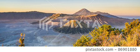 BANNER, LONG FORMAT Sunrise at the Bromo Tengger Semeru National Park on the Java Island, Indonesia. View on the Bromo or Gunung Bromo on Indonesian, Semeru and other volcanoes located inside of the BANNER, LONG FORMAT Sunrise at the Bromo Tengger Semeru National Park on the Java Island, Indonesia. View on the Bromo or Gunung Bromo on Indonesian, Semeru and other volcanoes located inside of the 86901880