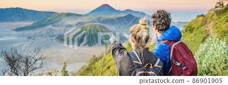BANNER, LONG FORMAT Young couple man and woman meet the sunrise at the Bromo Tengger Semeru National Park on the Java Island, Indonesia. They enjoy magnificent view on the Bromo or Gunung Bromo on BANNER, LONG FORMAT Young couple man and woman meet the sunrise at the Bromo Tengger Semeru National Park on the Java Island, Indonesia. They enjoy magnificent view on the Bromo or Gunung Bromo on 86901905