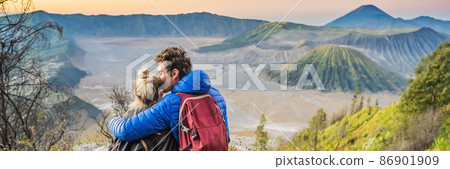 BANNER, LONG FORMAT Young couple man and woman meet the sunrise at the Bromo Tengger Semeru National Park on the Java Island, Indonesia. They enjoy magnificent view on the Bromo or Gunung Bromo on BANNER, LONG FORMAT Young couple man and woman meet the sunrise at the Bromo Tengger Semeru National Park on the Java Island, Indonesia. They enjoy magnificent view on the Bromo or Gunung Bromo on 86901909
