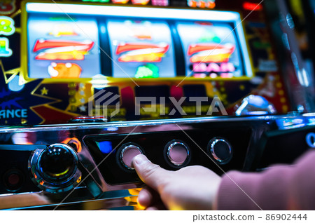 Hands to play slot machines [777 aligned] Background blur 86902444
