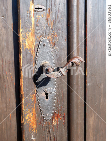 Wooden door of an old church Wooden door of an old church 86903961