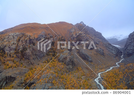 View of river and landscape furi mountain in autumn season from cable car in zermatt, swiss 86904001