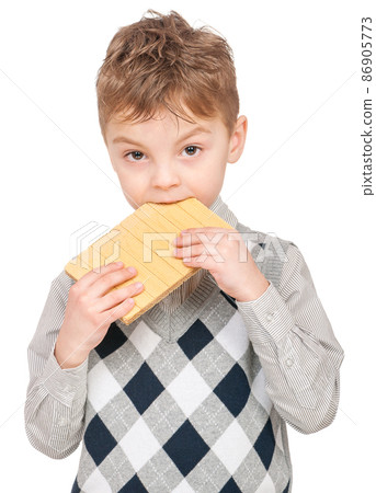 Little boy eating waffle 86905773