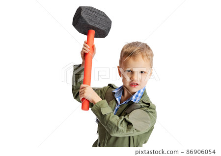 Emotional little boy, cute kid in image of auto mechanic or fitter in green dungarees with work tools isolated over white studio background. Childhood, education concept Emotional little boy, cute kid in image of auto mechanic or fitter in green dungarees with work tools isolated over white studio background. Childhood, education concept 86906054