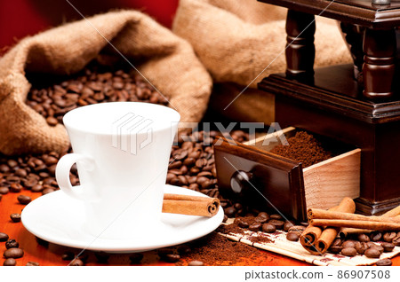 Coffee grinder and cup of coffee Coffee grinder and cup of coffee 86907508