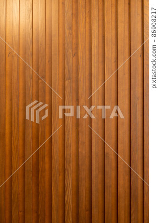 Decorative wall made of wood with wooden slats. Creative vintage background. Decorative wall made of wood with wooden slats. Creative vintage background. 86908217
