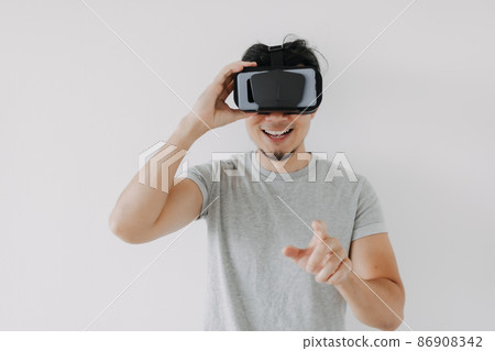 Man wears virtual glasses for interactive virtual meta world technology. Man wears virtual glasses for interactive virtual meta world technology. 86908342