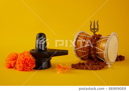 Happy Maha Shivaratri greeting card - Shiva Linga decorated with flowers, trishula, and damru. Hindu festival celebrated of Shiva Lord Happy Maha Shivaratri greeting card - Shiva Linga decorated with flowers, trishula, and damru. Hindu festival celebrated of Shiva Lord 86909089