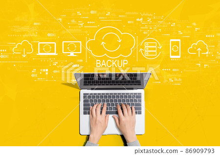 Backup concept with person using laptop Backup concept with person using laptop 86909793