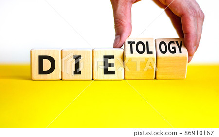 Dietology instead die symbol. Doctor turns wooden cubes and changes the word die to dietology. Beautiful yellow table, white background. Healthy lifestyle, dietology instead die concept. Copy space. Dietology instead die symbol. Doctor turns wooden cubes and changes the word die to dietology. Beautiful yellow table, white background. Healthy lifestyle, dietology instead die concept. Copy space. 86910167