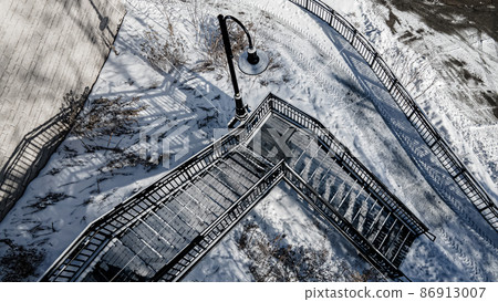Snow covered urban stairs with snow 86913007