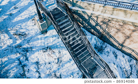 Snow covered urban stairs with snow 86914086