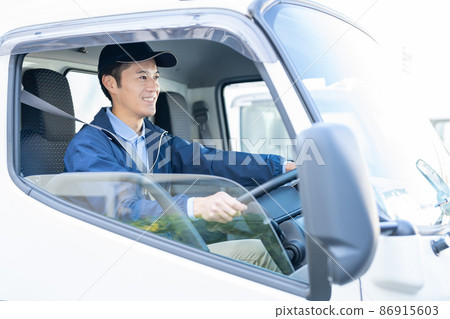 Male driver working on a courier Male driver working on a courier 86915603