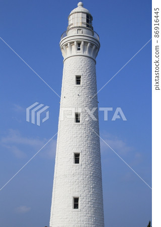 Japan's tallest Izumo Hinomisaki Lighthouse towering over the blue sky 86916445