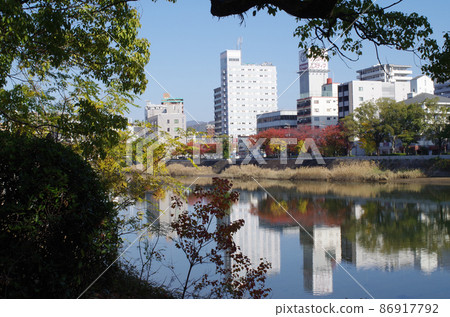 Hiroshima cityscape seen from the Tenma Riverside park Hiroshima cityscape seen from the Tenma Riverside park 86917792