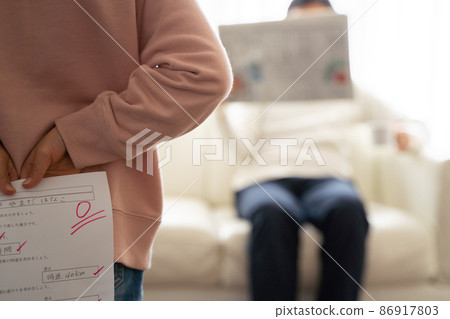 A child hiding his test score A child hiding his test score 86917803