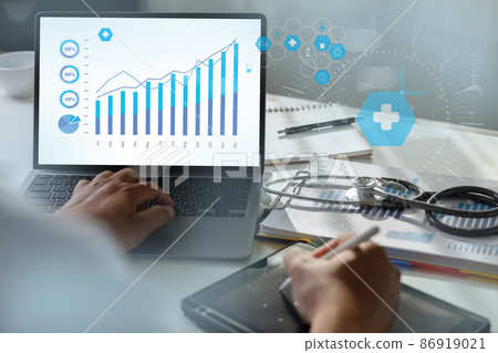 Insurance Healthcare  Doctor analyzing medical  report and medical  on hospital background 86919021
