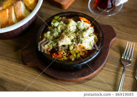 Delicious traditional dish cooked in a pot, which is called Saute in Turkish  86919085