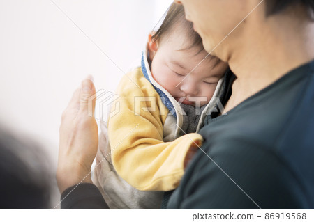 A baby who drinks milk and sleeps full 86919568