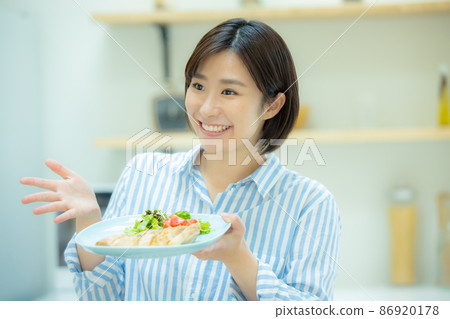 Woman in the kitchen Woman in the kitchen 86920178