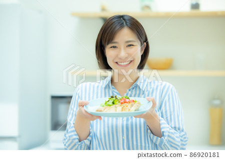 Woman in the kitchen Woman in the kitchen 86920181