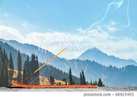 Burning incense stick in the asian mountains Burning incense stick in the asian mountains 86923403