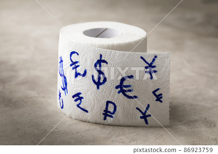 Toilet paper roll with currency symbols of different countries painted on it, bloated economy concept, joke, money is just paper Toilet paper roll with currency symbols of different countries painted on it, bloated economy concept, joke, money is just paper 86923759