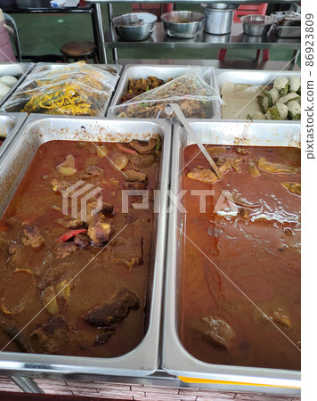 Malaysian traditional Malay cuisine is on display for sale at roadside stalls. Rich in spices and recipes from local ingredients. Customers are free to choose what they like 86923809
