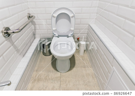 View of a new toilet and bathroom interior for hospital, white and clean View of a new toilet and bathroom interior for hospital, white and clean 86926647