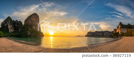 Tropical islands sunset view with ocean sea water and sand beach at Railay Beach, Krabi Thailand nature landscape panorama 86927119