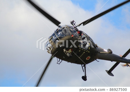 the military helicopter on with the blue sky the military helicopter on with the blue sky 86927500