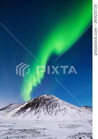 Aurora Borealis in Iceland. Northern Lights over the mountains. 86928719