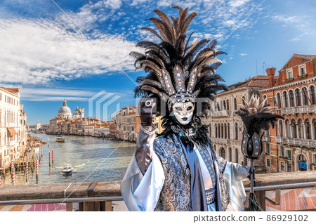 Colorful carnival masks at a traditional festival in Venice, Italy Colorful carnival masks at a traditional festival in Venice, Italy 86929102