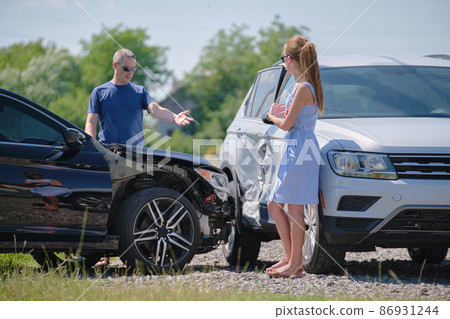 Drivers of smashed vehicles arguing who is guilty in car crash accident on street side. Road safety and insurance concept Drivers of smashed vehicles arguing who is guilty in car crash accident on street side. Road safety and insurance concept 86931244