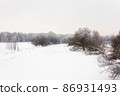 Frozen river Klyazma and trees on the bank in the Moscow region. 86931493