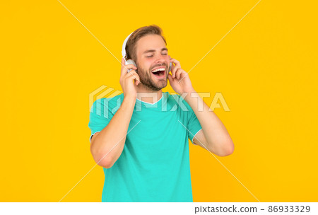 happy guy with bristle listen music on yellow background, music happy guy with bristle listen music on yellow background, music 86933329