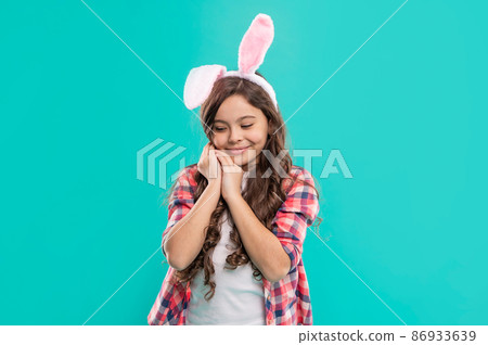 Playful rabbit. teenager girl wear rabbit costume. easter bunny hunt. just having fun. 86933639