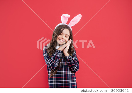happy teen girl in funny bunny ears for easter holiday, childhood happy teen girl in funny bunny ears for easter holiday, childhood 86933641
