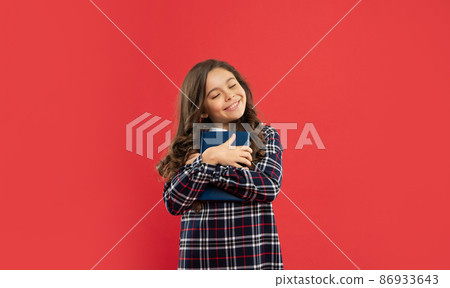 positive pupil or student hold notebook. teen girl study with book. child holding copybooks. positive pupil or student hold notebook. teen girl study with book. child holding copybooks. 86933643