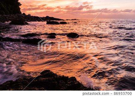 The orange-colored sea of the Genkai Sea at sunset The orange-colored sea of the Genkai Sea at sunset 86933700